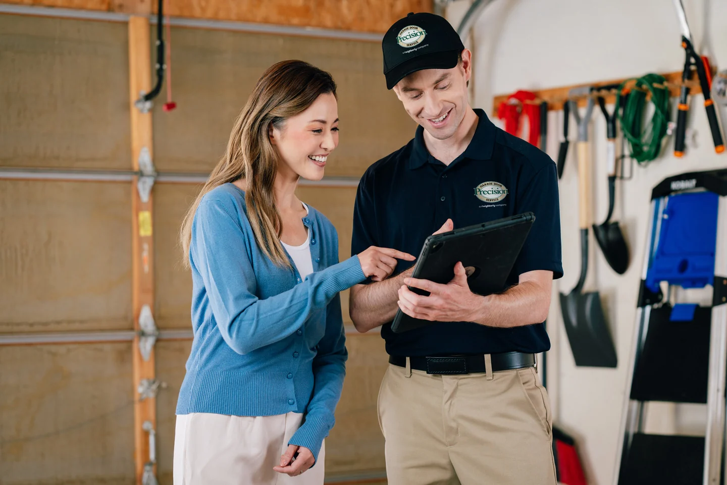 Precision technician and customer reviewing repairs